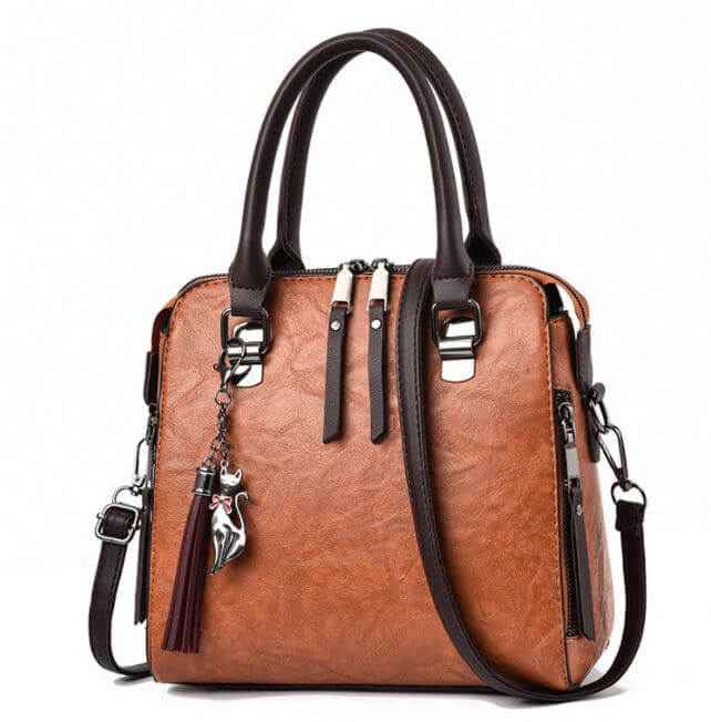 Ladies luxury handbag with zipper, soft surface material, and adjustable strap.