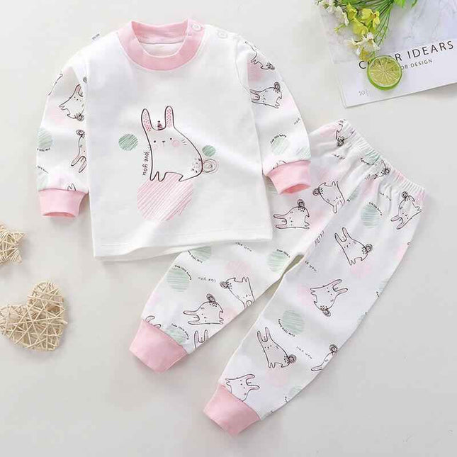 Children's cotton pajamas with pink cuffs and playful animal pattern, suitable for boys and girls.