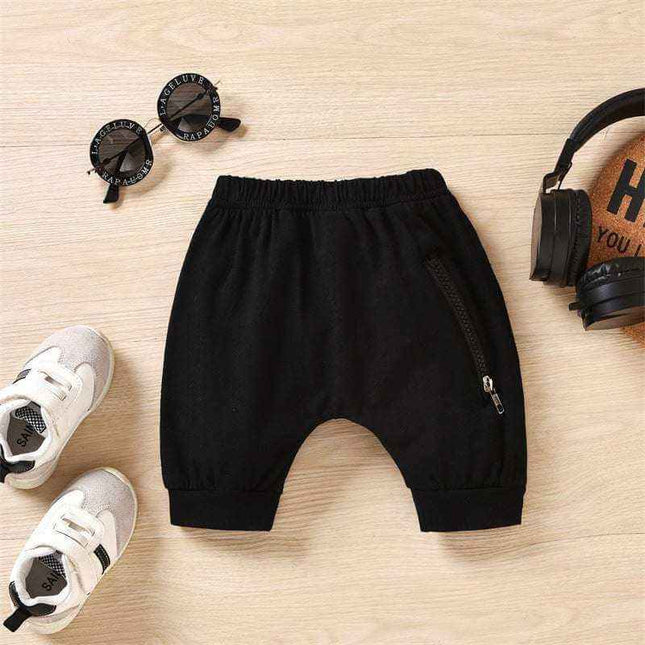 Boys' hooded striped tank top pants set with black shorts and trendy accessories.