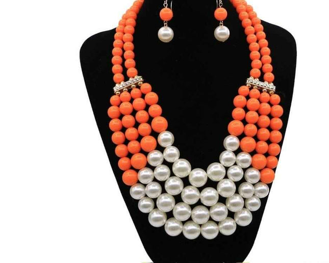 Multi Simulated Pearl Bohemian Jewelry Set with orange beads and faux pearls on display.