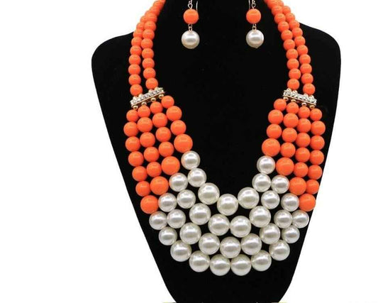 Multi Simulated Pearl Bohemian Jewelry Set with orange and white beads on display.