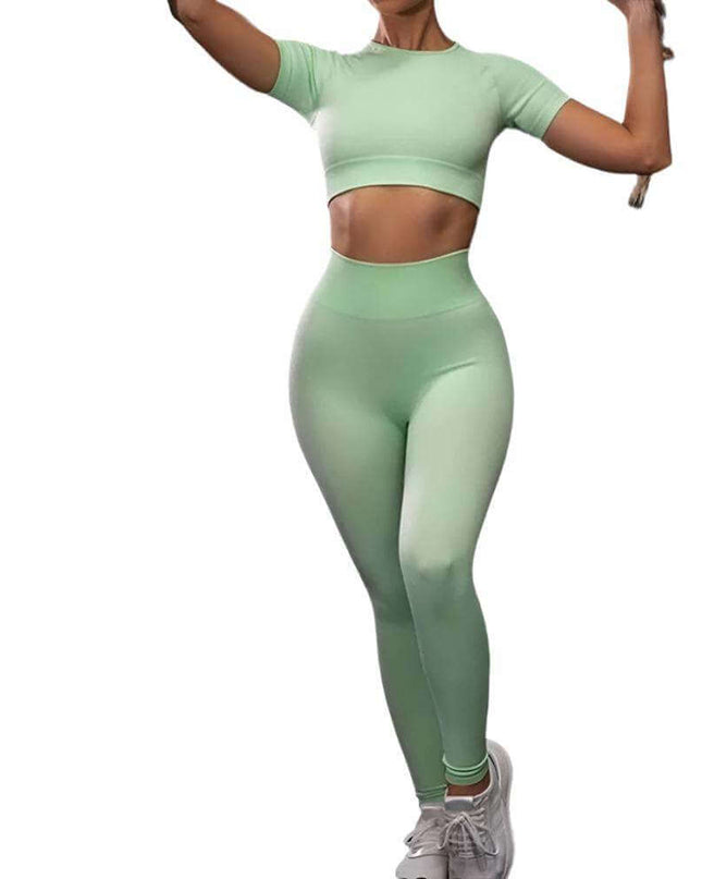 Seamless Yoga Sport Fitness Women Leggings and Short Sleeve Top in light green, showcasing comfort and style for workouts.