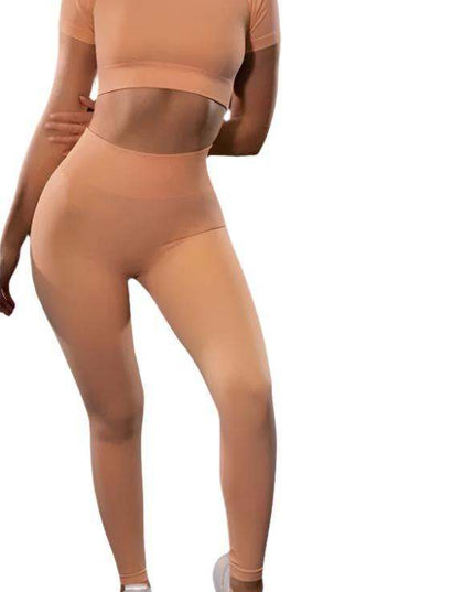 Seamless Yoga Sport Fitness Women Leggings and Short Sleeve Tops in peach color.