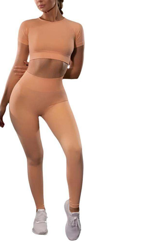 Seamless Yoga Sport Fitness Women Leggings and Short Sleeve Top in peach color.