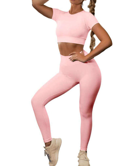 Seamless Yoga Sport Fitness Women Leggings and Short Sleeve Tops in pink, ideal for comfortable workouts.