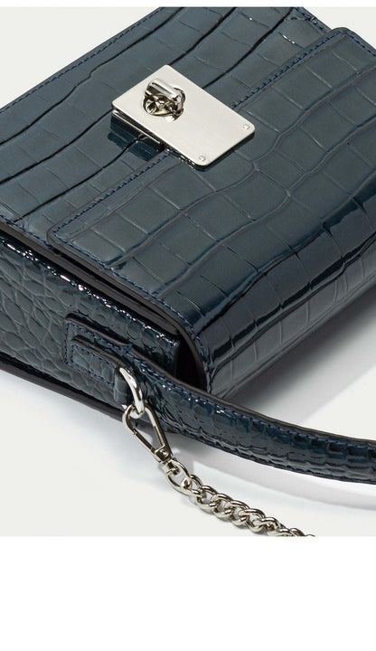 New Leather Handbag with crocodile pattern and metal clasp.