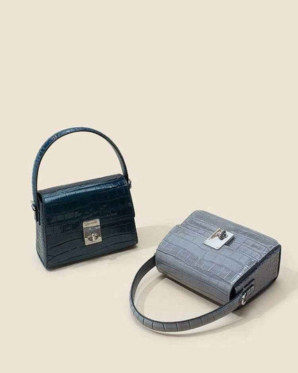 New Leather Handbags in fashionable trapezoid shape with single shoulder strap.