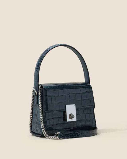 New Leather Handbags in luxurious trapezoid shape with single shoulder strap.