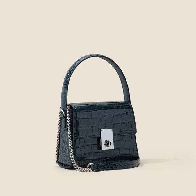 New Leather Handbags in luxurious trapezoid shape with single shoulder strap.