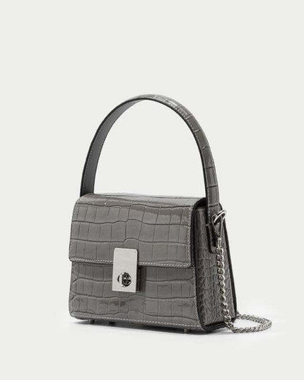 New Leather Handbags in trapezoid shape with single shoulder strap.