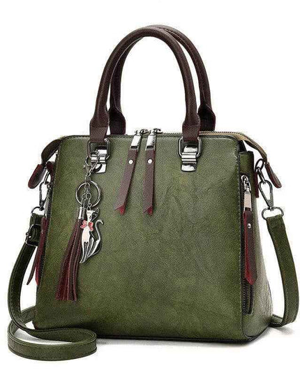 Luxury ladies hand bags, stylish green crossbody bag with brown handles, zipper opening, and spacious design.