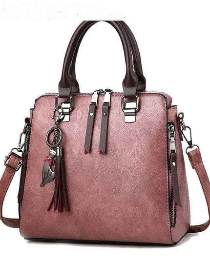 Luxury ladies handbag with soft surface, spacious design, and adjustable crossbody strap.