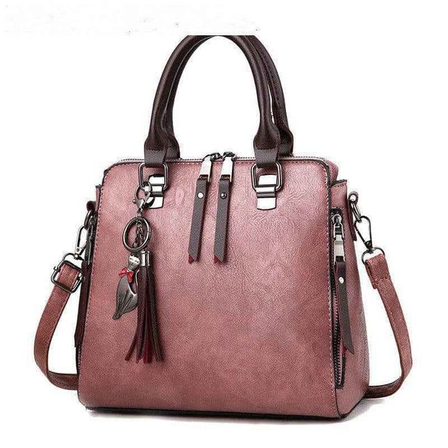 Luxury ladies handbag with soft surface, spacious design, and adjustable crossbody strap.