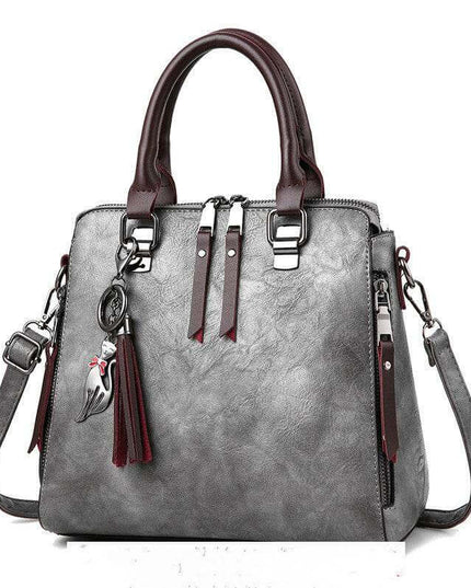 Luxury ladies handbag with soft surface, spacious design, adjustable strap.