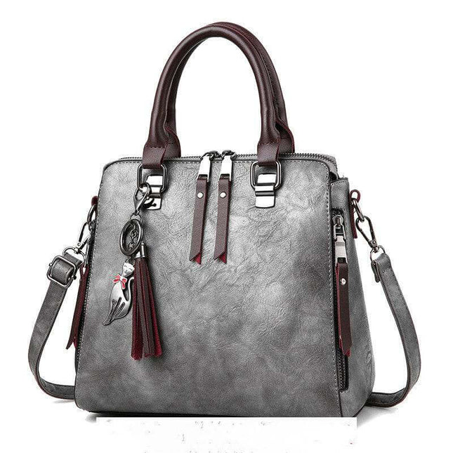 Luxury ladies handbag with soft surface, spacious design, adjustable strap.