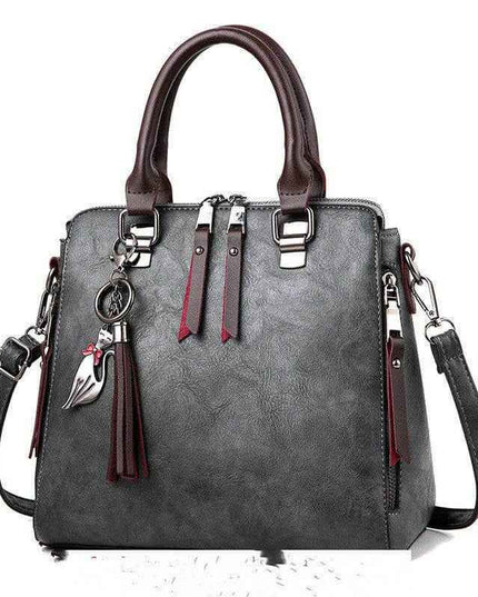 Luxury ladies handbag, crossbody bag with zipper, soft material, trendy design.