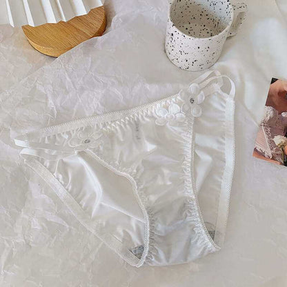 Silky embroidered floral decorated low waist briefs for women.