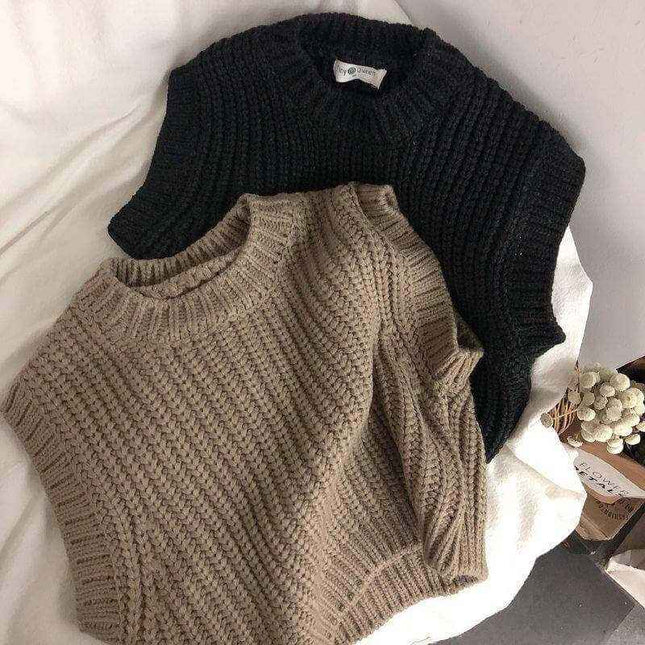 Children's thick stripe wool pullover sweaters in black and beige.