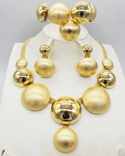 Four-piece alloy jewelry set with necklaces, pendants, earrings, and accessories, featuring a gold electroplated finish.