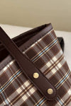 Plaid leather tote bag for women with brown, white, and blue checkered design.