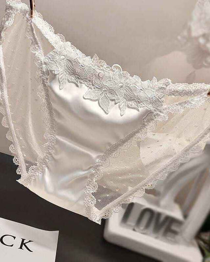 Women's mesh see-through low waist underwear in white lace design.