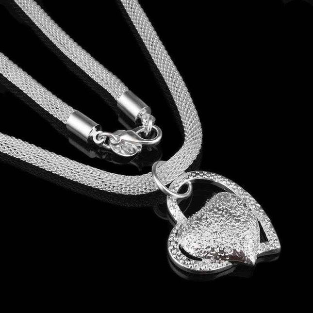 Fine Jewelry Silver Net Style Heart Necklace with electroplated silver finish.