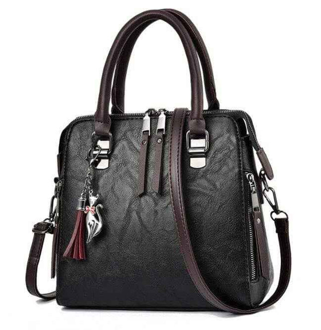 Luxury ladies handbag with soft surface material, spacious design, and adjustable crossbody strap.