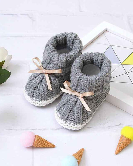 Fashionable and lightweight toddler shoes in gray with ribbon accents.