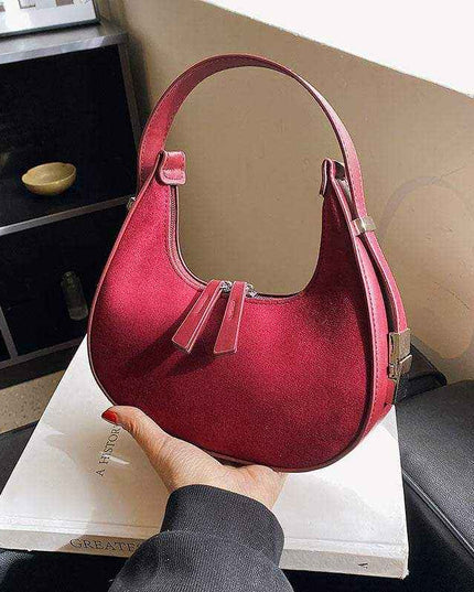 Fashion high-grade matte French handbag in burgundy with single shoulder strap and soft handle.