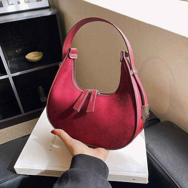 Fashion high-grade matte French handbag in burgundy with single shoulder strap and soft handle.