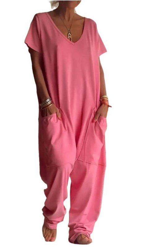 Womens solid color V-neck oversized pocket jumpsuit in pink.