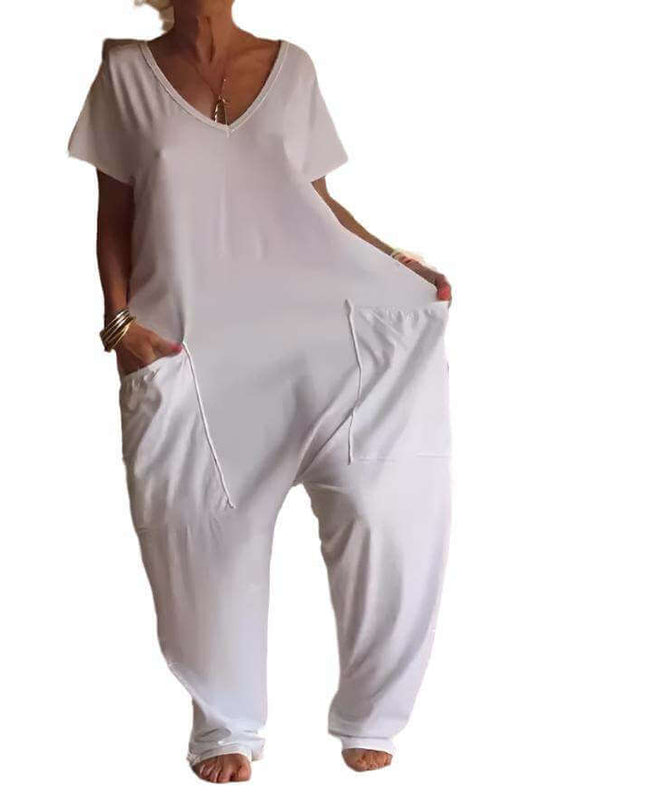 Womens solid color V-neck oversized jumpsuit with pockets, polyester fabric.