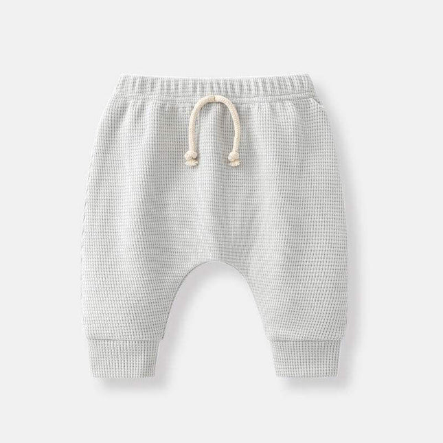 Boys' fashion simple waffle trousers with elastic waistband and cuffs.