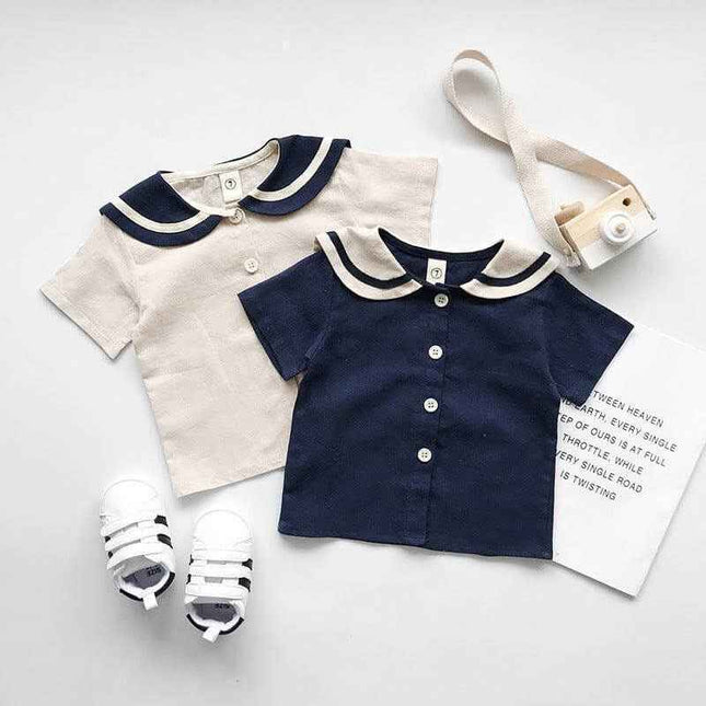 Boys and girls navy and beige short-sleeved sets with buttons, made of 90% cotton.