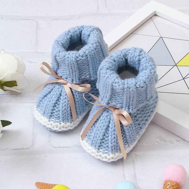 Fashionable and lightweight toddler shoes in blue with ribbon ties.