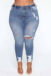 Plus size stretch ripped jeans for women in blue denim.