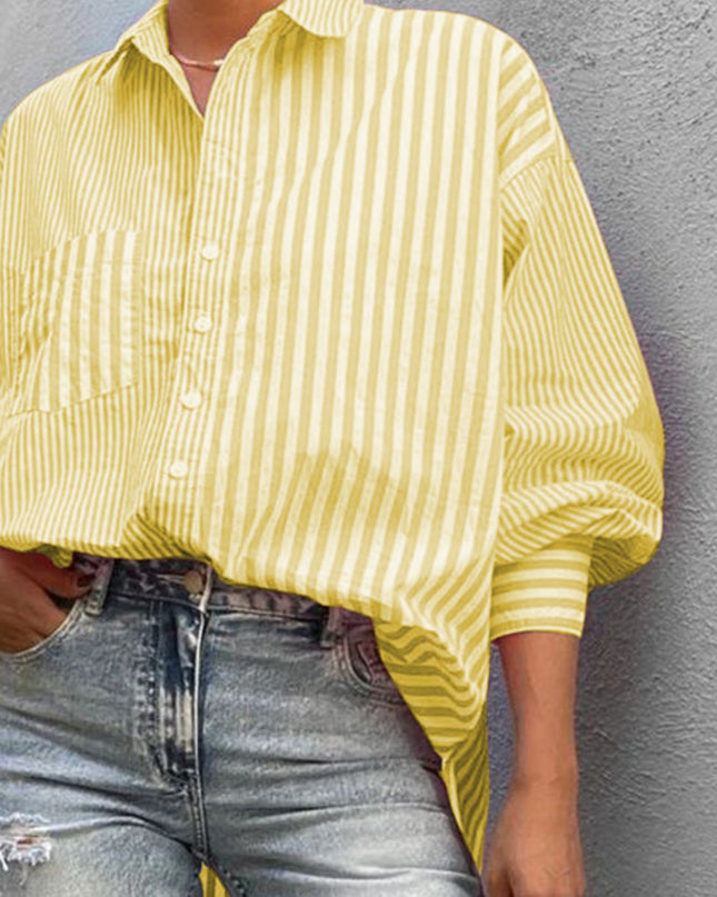 Striped button down long sleeve shirt in yellow with pocket detail, paired with jeans.