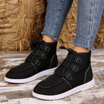 Round Toe Flat Sneakers in black with lace-up design and comfortable fit.