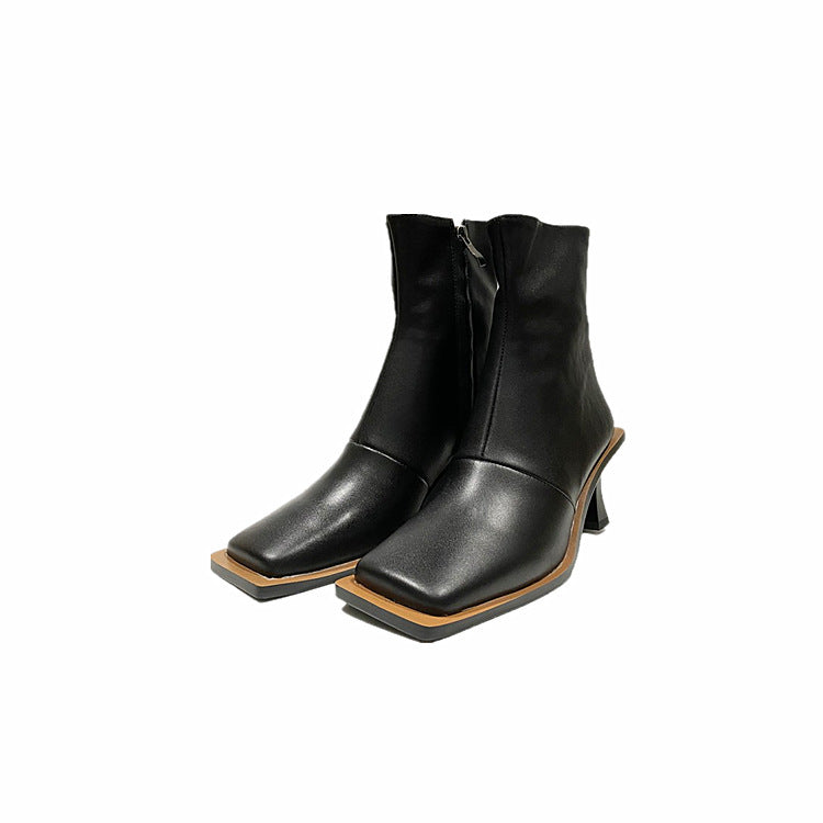 Fashion leather high-heeled Martin boots in black with thick heel and rubber sole.