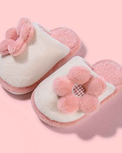 Cute pink cartoon parent-child slippers with non-slip soft soles and plush flower design.