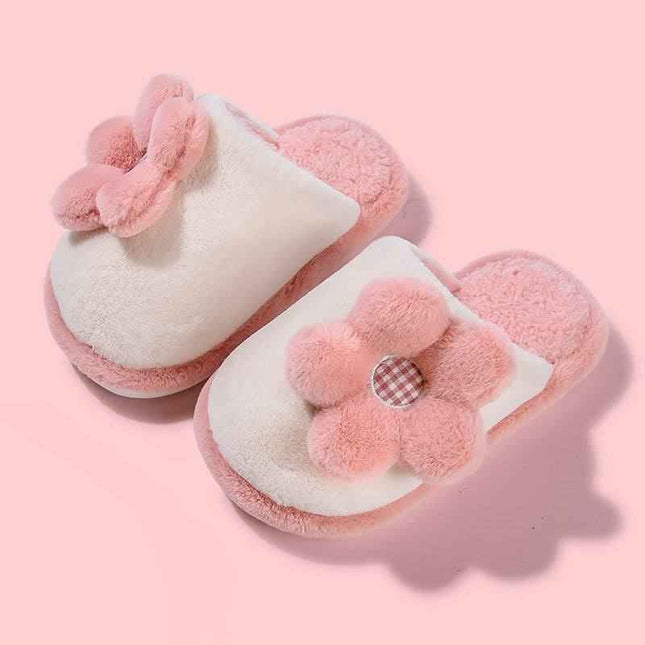 Cute pink cartoon parent-child slippers with non-slip soft soles and plush flower design.