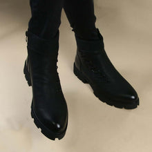  Women's black ankle motorcycle boots with rubber soles, featuring a stylish knit cuff, perfect for spring fashion.