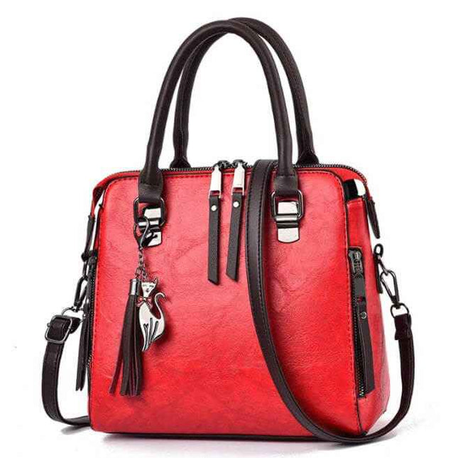 Ladies luxury handbag in red with black handles, featuring a zipper opening, sandwich zipper bag, and adjustable strap.