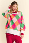 Davi & Dani Exposed Seam Color Block Sweater with bold design and relaxed fit.