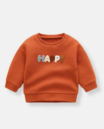 Boys' fashion simple waffle top in orange with colorful "HAPPY" text design.