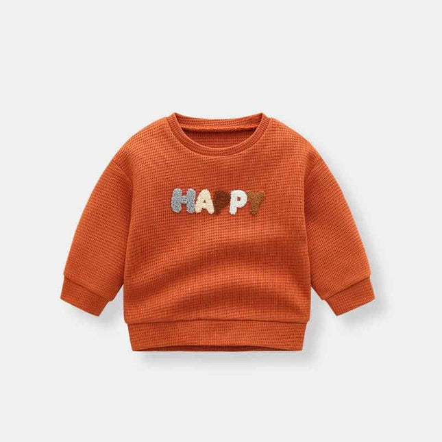 Boys' fashion simple waffle top in orange with colorful "HAPPY" text design.