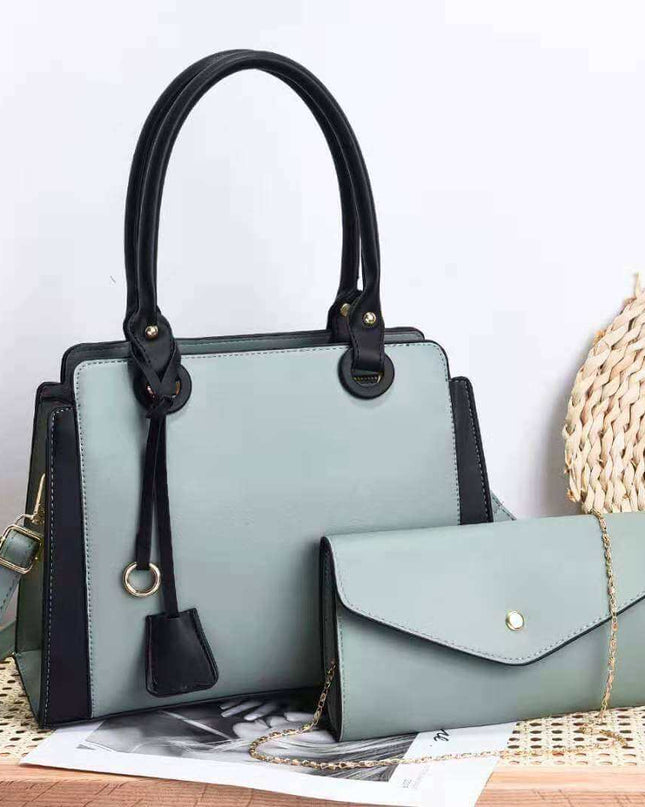 Trendy women's handbag in green PU leather with multiple compartments and black accents.