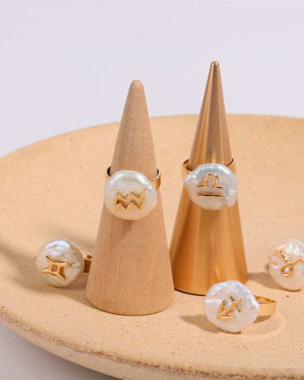 Cosmic Constellation Ring with zodiac symbols displayed on cones.