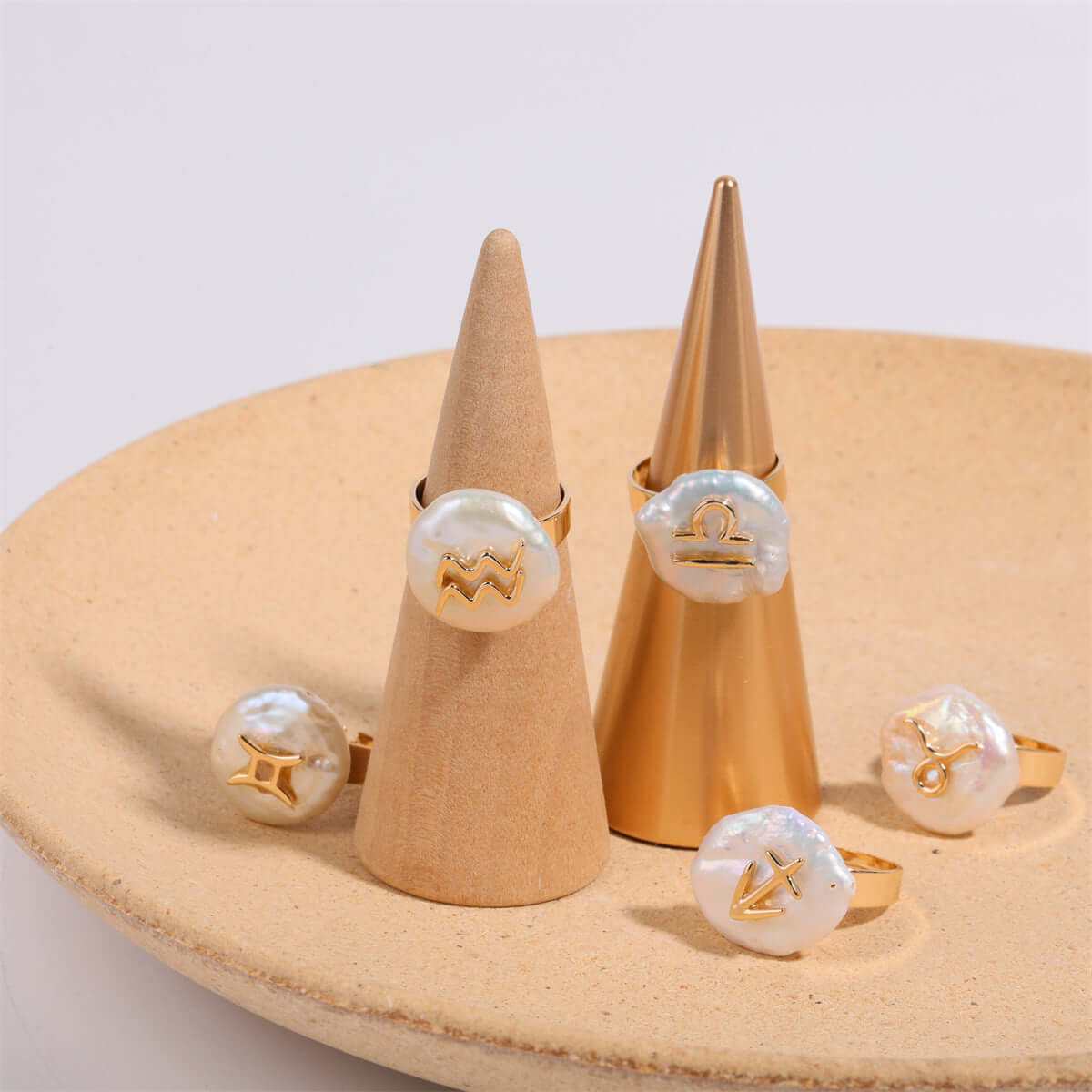 Cosmic Constellation Ring with zodiac symbols displayed on cones.