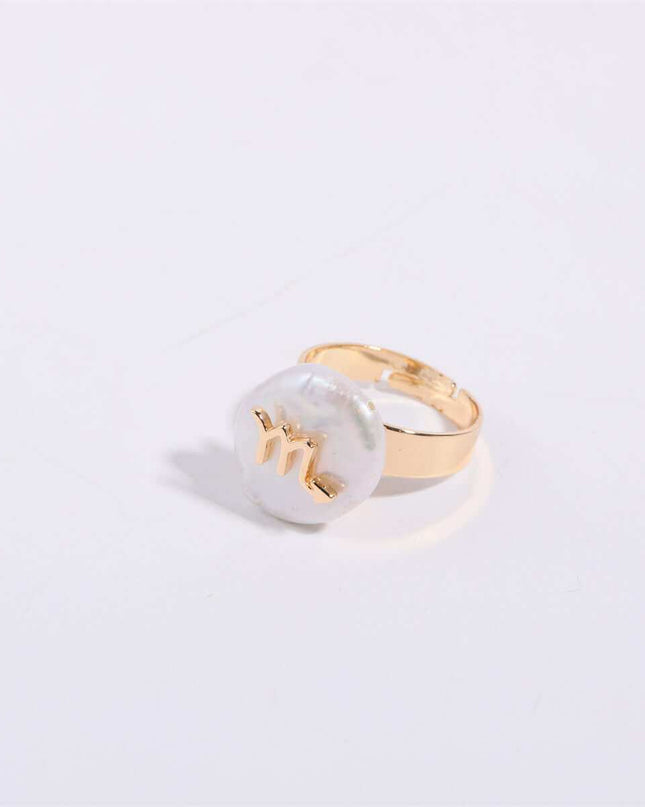 Cosmic Constellation Ring featuring celestial star sign design on a gold band.